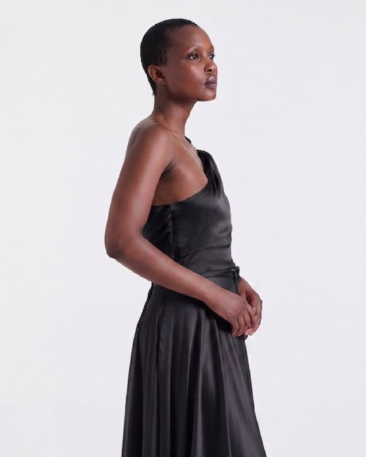 Annie Asymmetrical Top in Black, gold brooch detail, RSVP edit, Deméa Paris